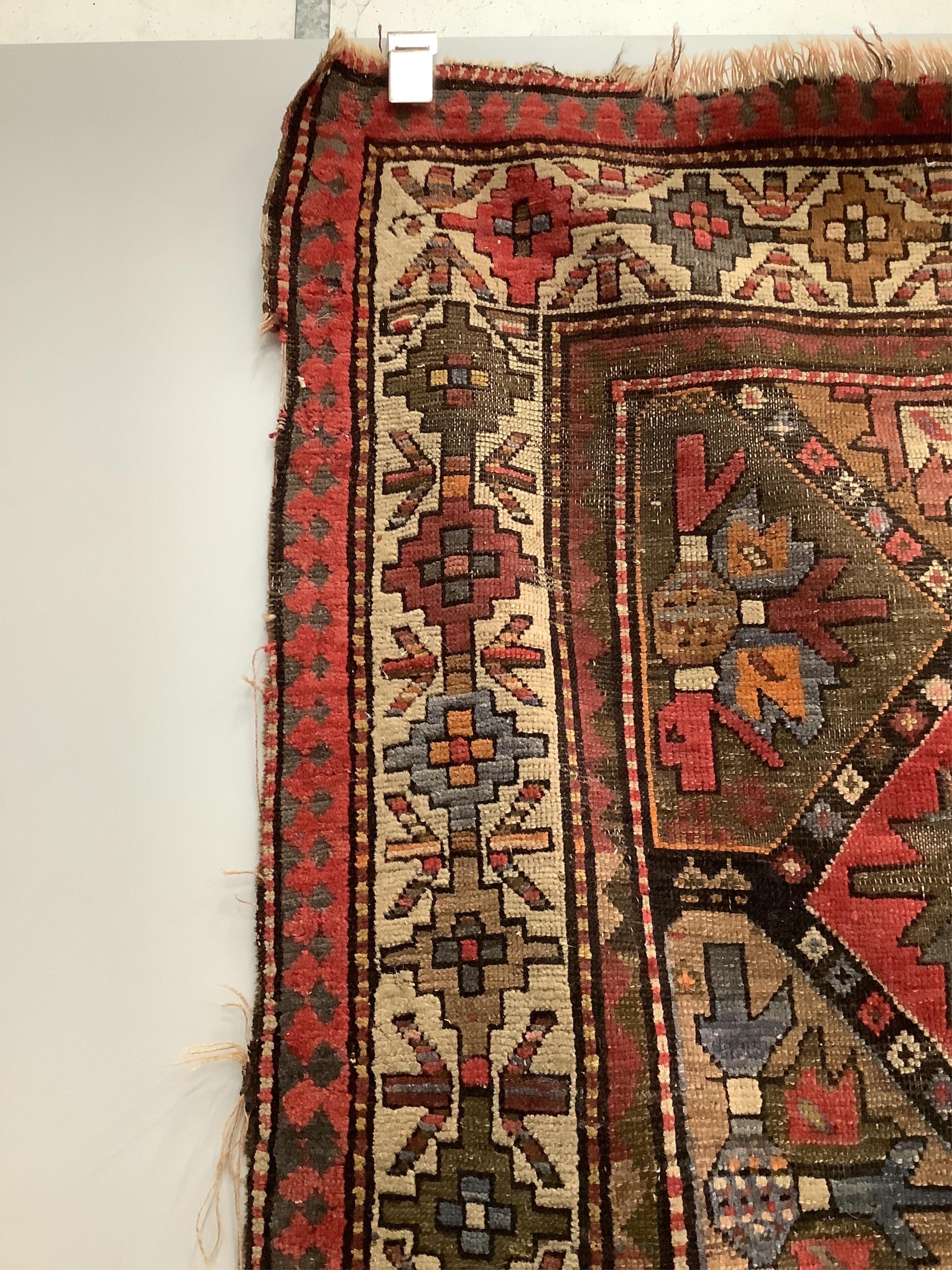 An antique Caucasian geometric rug, 250 x 140cm. Condition - poor